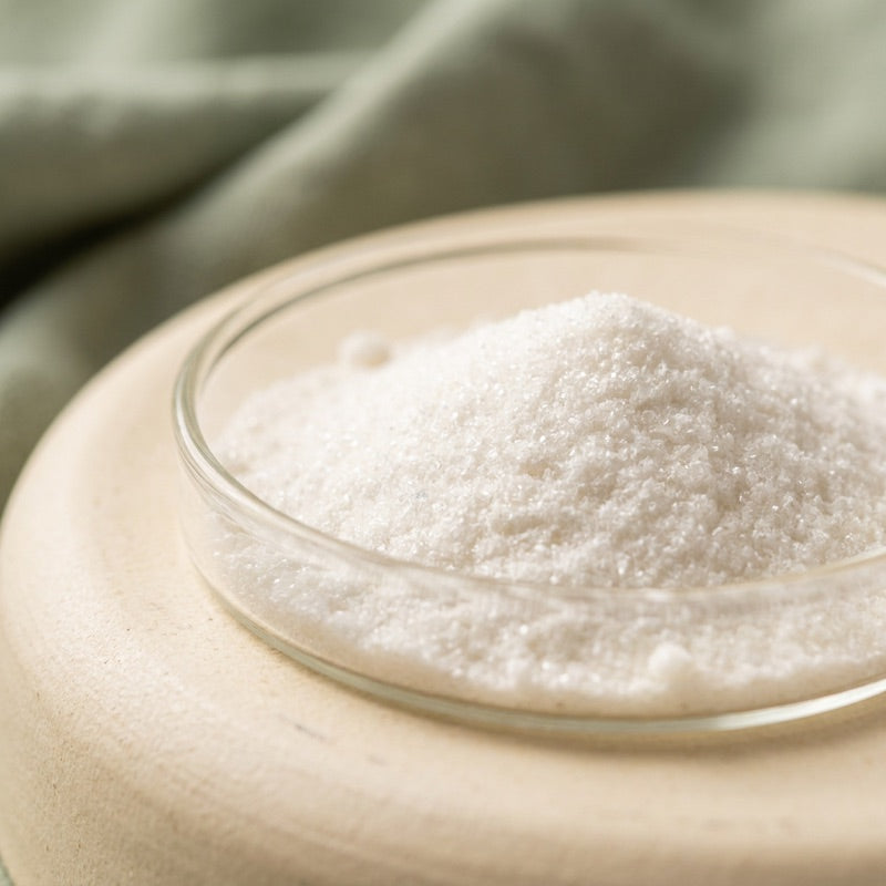 L-Tryptophan ingredient in a glass dish